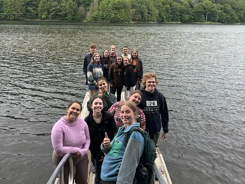 College student on the dock at Adventure Bound, Wyman Lake.